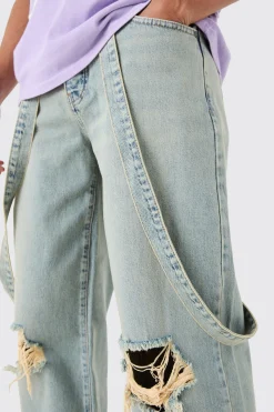 Baggy Rigid Strap Detail Ripped Knee Jeans In Antique Blue | BoohooMAN UK