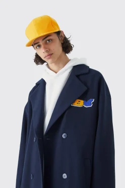 Double Breasted Longline Varsity Badge Overcoat | BoohooMAN UK