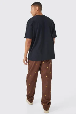 Fixed Waist Relaxed All Over Embroidery Trouser | BoohooMAN UK
