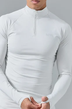 Man Active Muscle Fit 1/4 Zip Top | BoohooMAN UK