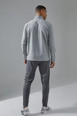 Man Active Shower Resist 1/4 Zip Funnel Neck Windbreaker | BoohooMAN UK