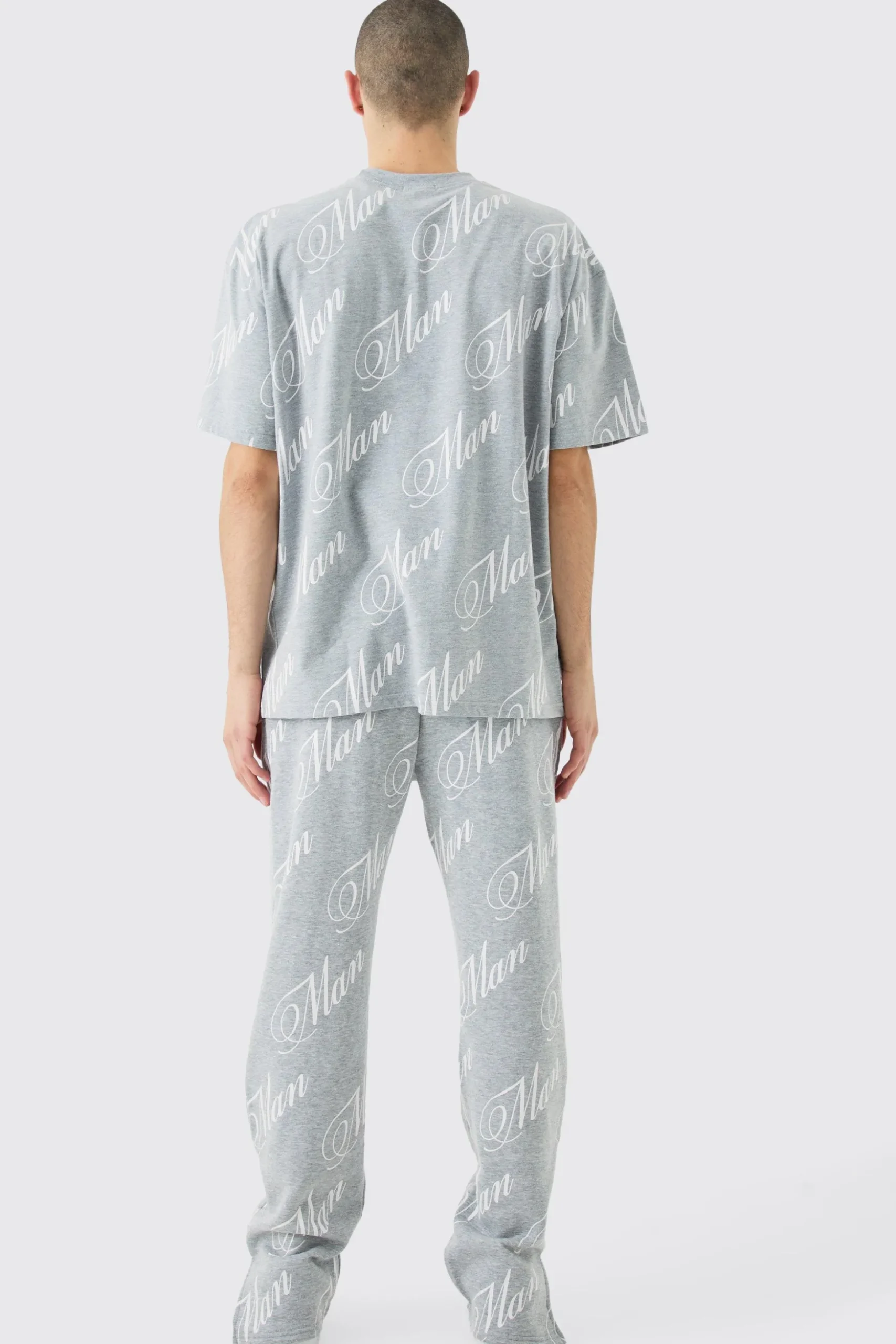 Man Script All Over Print Split Hem Tshirt & Jogger Set | BoohooMAN UK