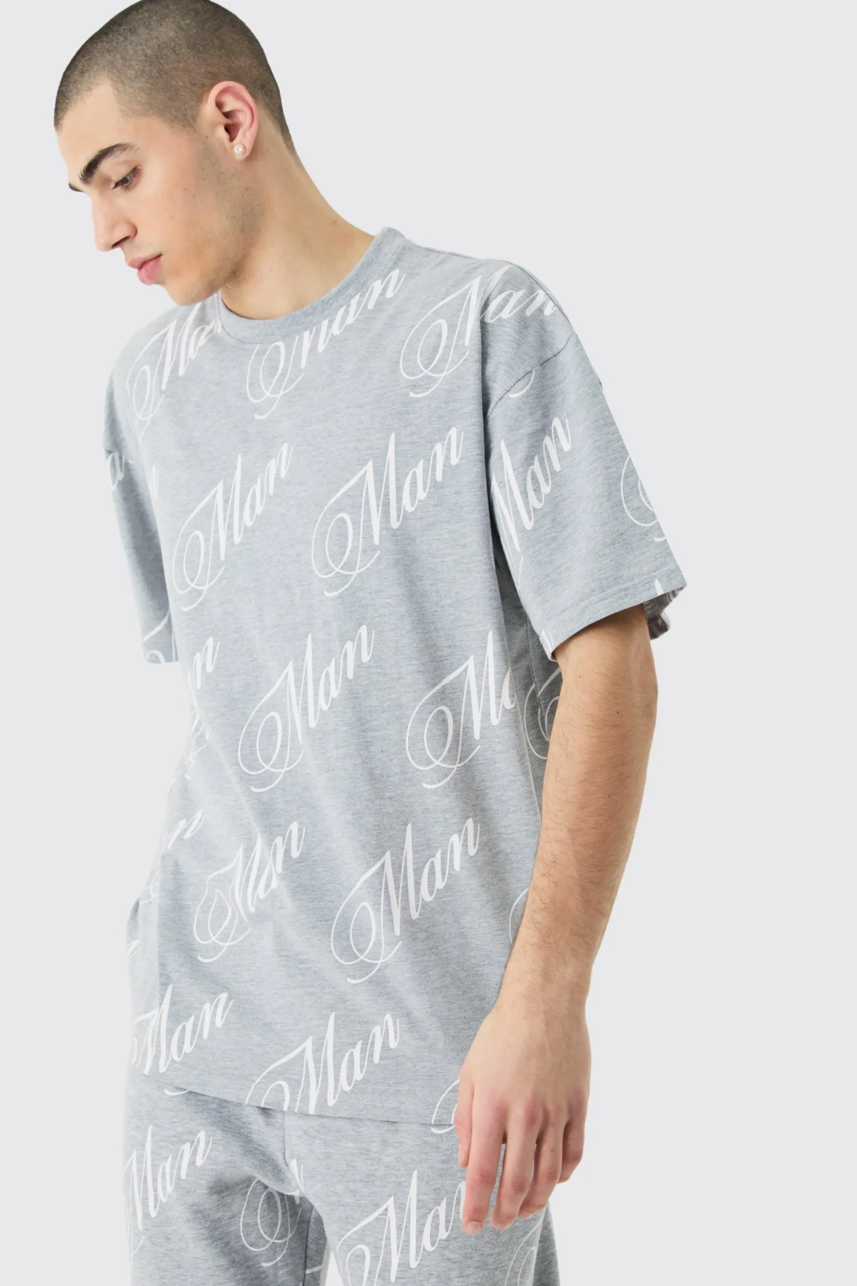 Man Script All Over Print Split Hem Tshirt & Jogger Set | BoohooMAN UK
