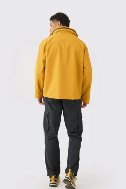 Man Tab Oversized Zip Detail Nylon Windbreaker In Mustard | BoohooMAN UK
