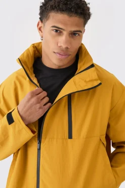 Man Tab Oversized Zip Detail Nylon Windbreaker In Mustard | BoohooMAN UK