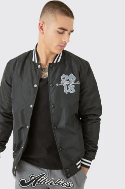 Official Badge Nylon Varsity Bomber Jacket In Black | BoohooMAN UK