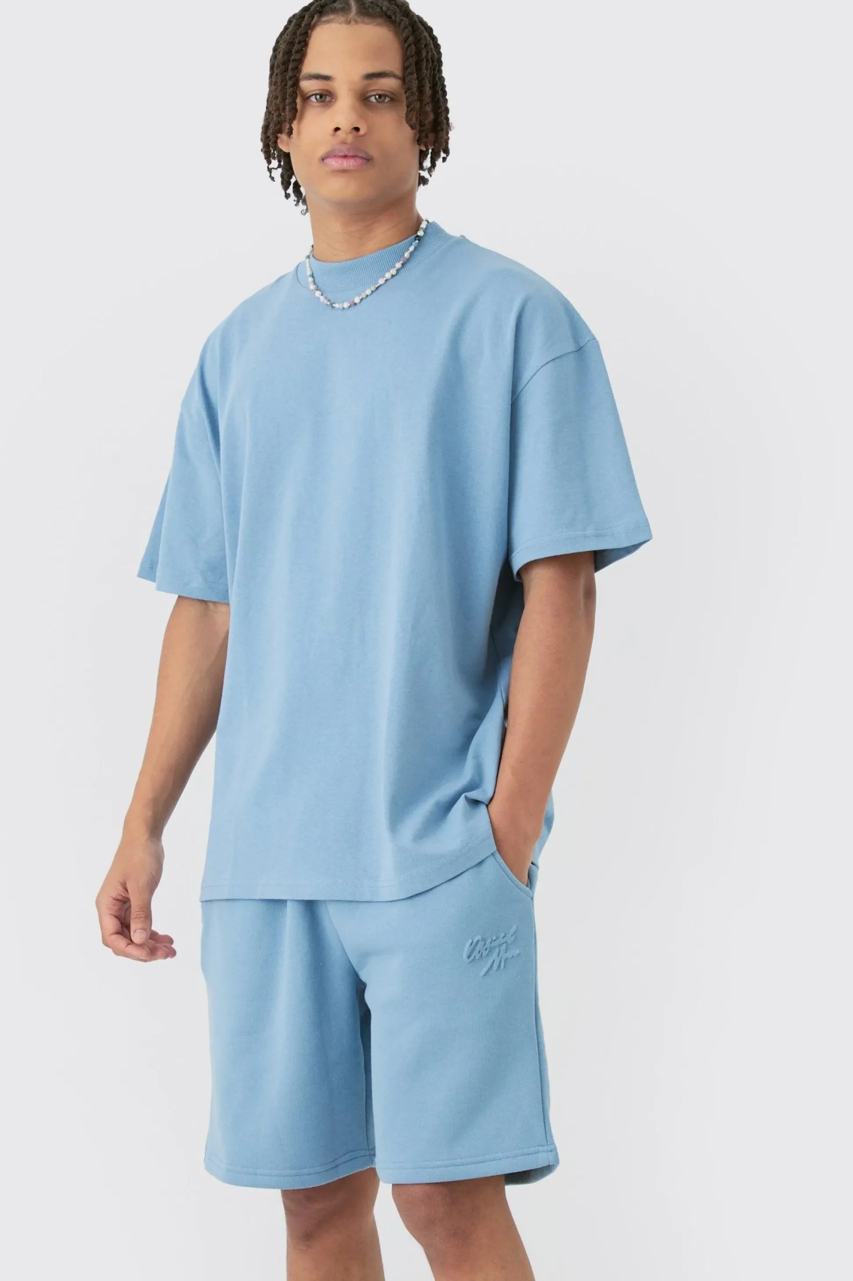 Oversized Extended Neck Official Man Embossed T-shirt & Short Set | BoohooMAN UK
