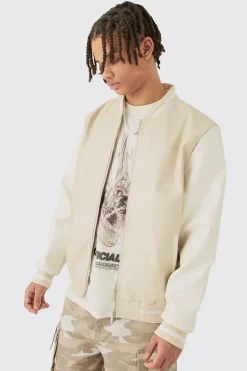 Plain PU Varsity Jacket In Beige | BoohooMAN UK