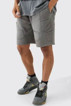 Relaxed All Over Pocket Spray Wash Shorts | BoohooMAN UK