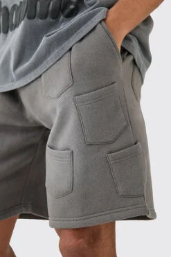 Relaxed All Over Pocket Spray Wash Shorts | BoohooMAN UK