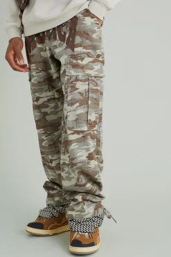 Relaxed Cargo Varsity Slogan Print Camo Trouser | BoohooMAN UK