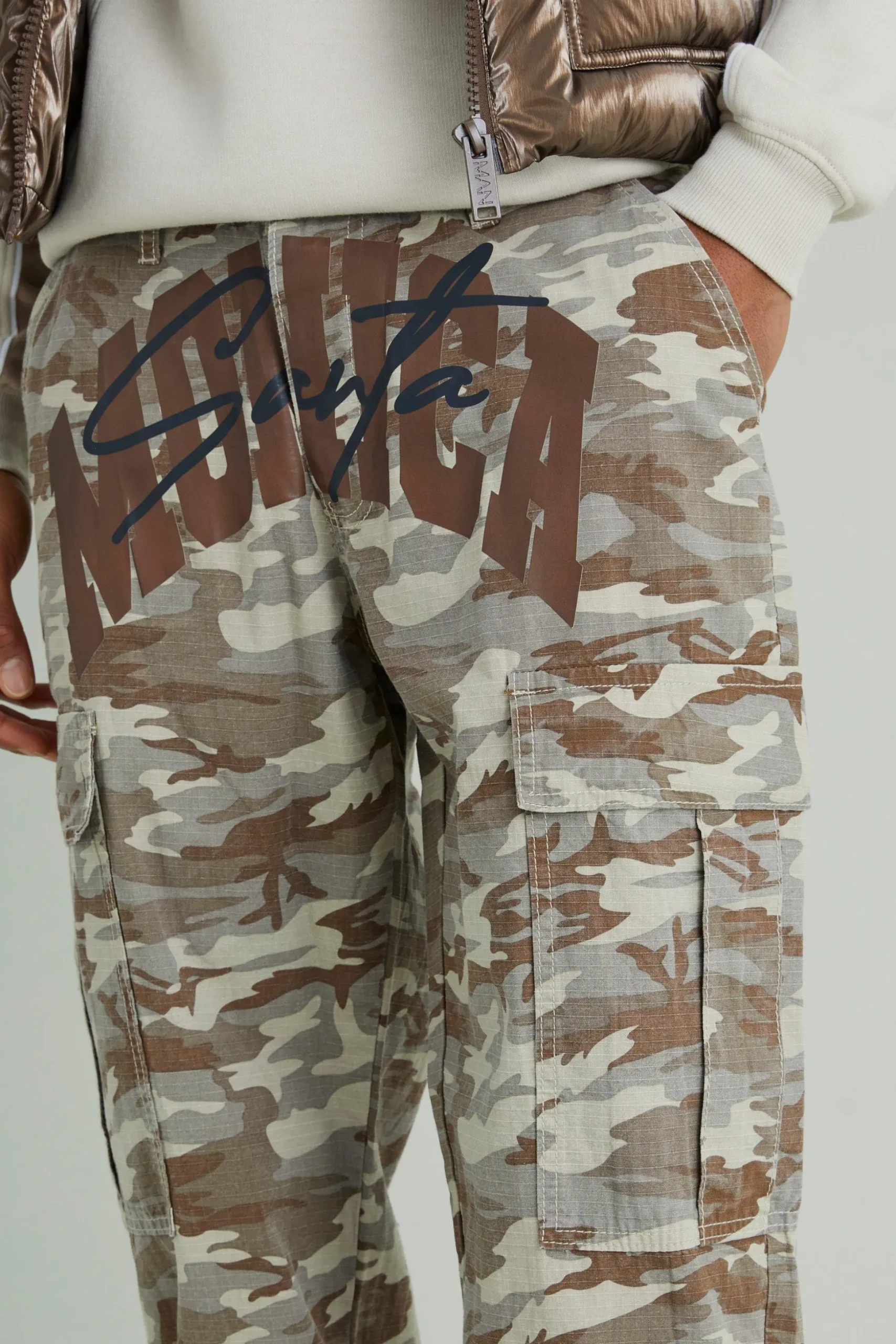 Relaxed Cargo Varsity Slogan Print Camo Trouser | BoohooMAN UK