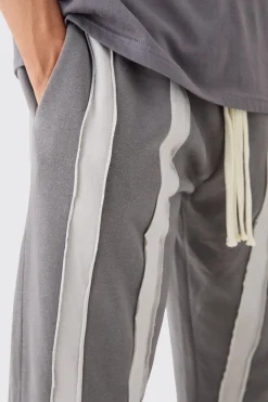 Relaxed Cut & Sew Stripe Raw Edge Joggers | BoohooMAN UK