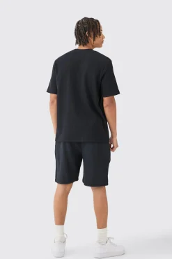 Relaxed Mid Length Textured Short With Woven Tab | BoohooMAN UK