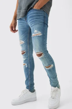 Skinny Fit All Over Ripped Jeans | BoohooMAN UK