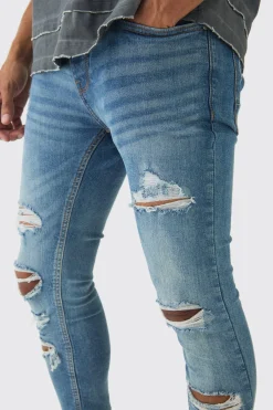 Skinny Fit All Over Ripped Jeans | BoohooMAN UK