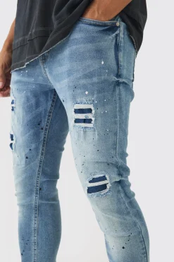 Skinny Fit Rip & Repair Paint Splatter Jeans | BoohooMAN UK
