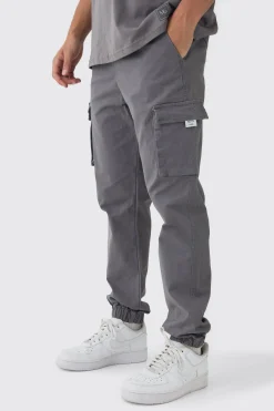 Slim Fit Elasticated Waist Woven Tab Cuffed Cargo Trousers | BoohooMAN UK
