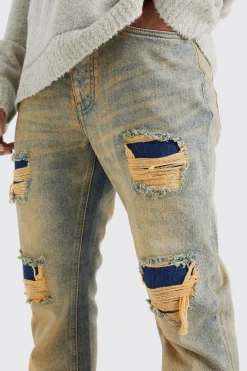 Slim Flare Rigid Multi Rip & Repair Jean | BoohooMAN UK