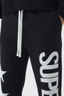 Slim Flared Stacked Superstar Puff Printed Joggers | BoohooMAN UK