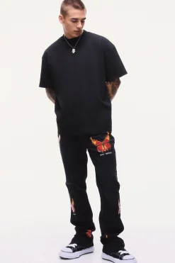 Slim Rigid Flare Popper Hem Graphic Butterfly Jeans | BoohooMAN UK