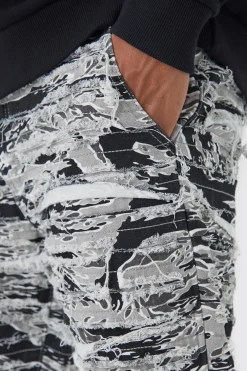 Slim Stacked Flare Heavily Distressed Camo Trouser | BoohooMAN UK