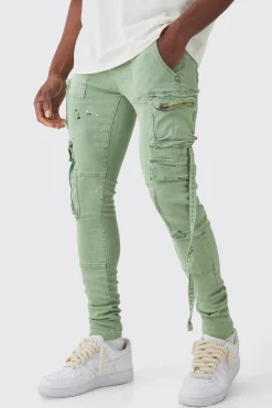 Super Skinny Stretch Strap Detail Paint Splatter Cargo Jeans | BoohooMAN UK